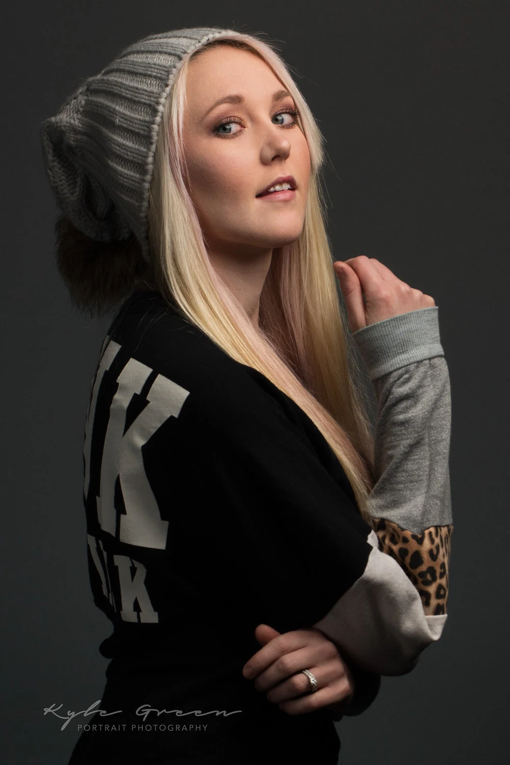 Studio portrait of a woman in a grey jacket