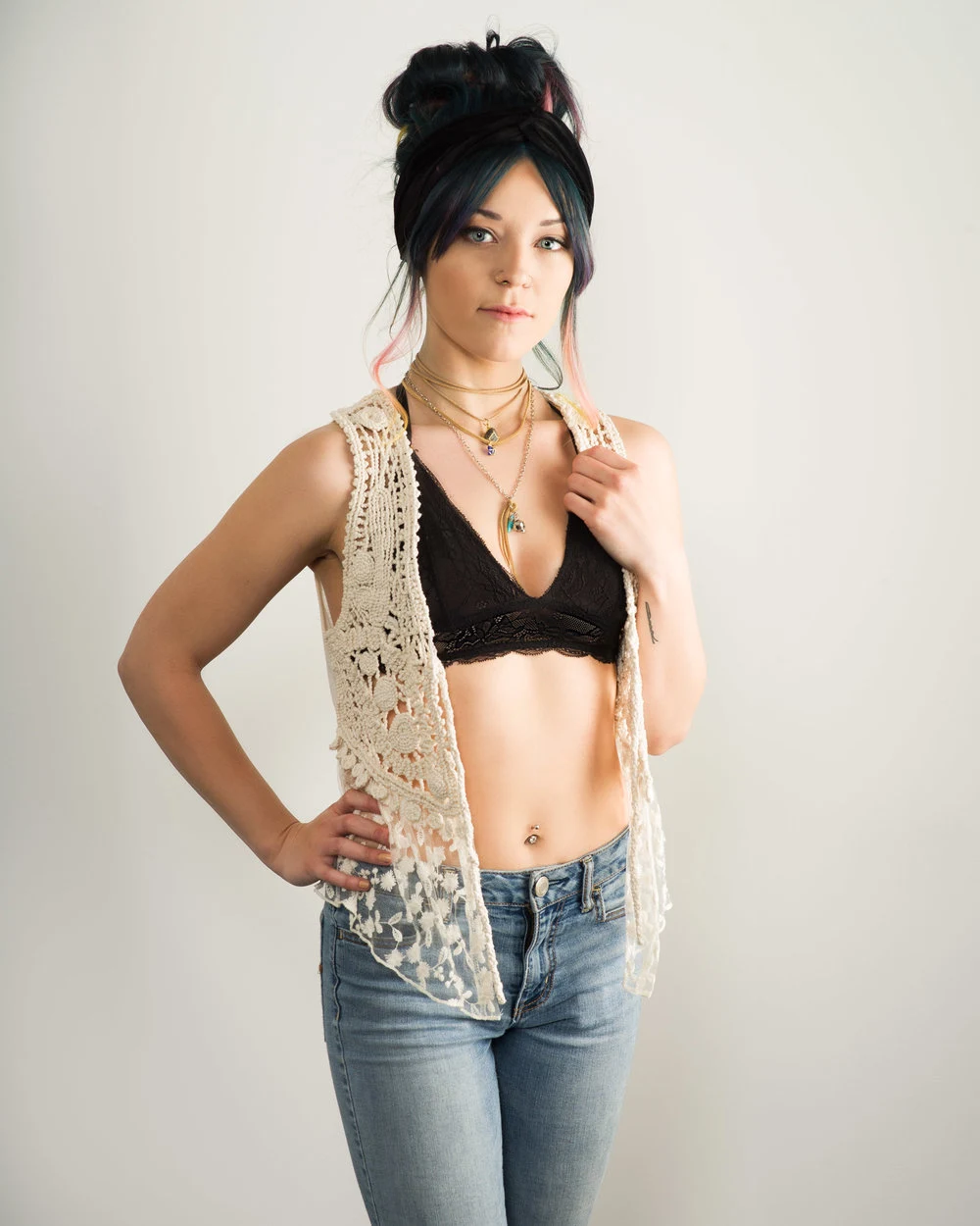 Fashion portrait in a black bralette and jeans