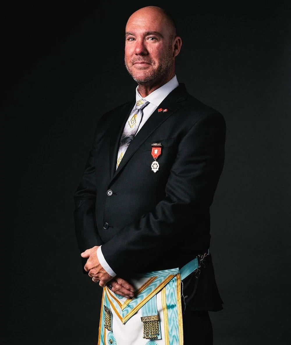 Formal portrait wearing ceremonial regalia