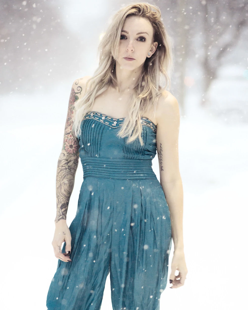Portrait in a blue dress with a wintry backdrop