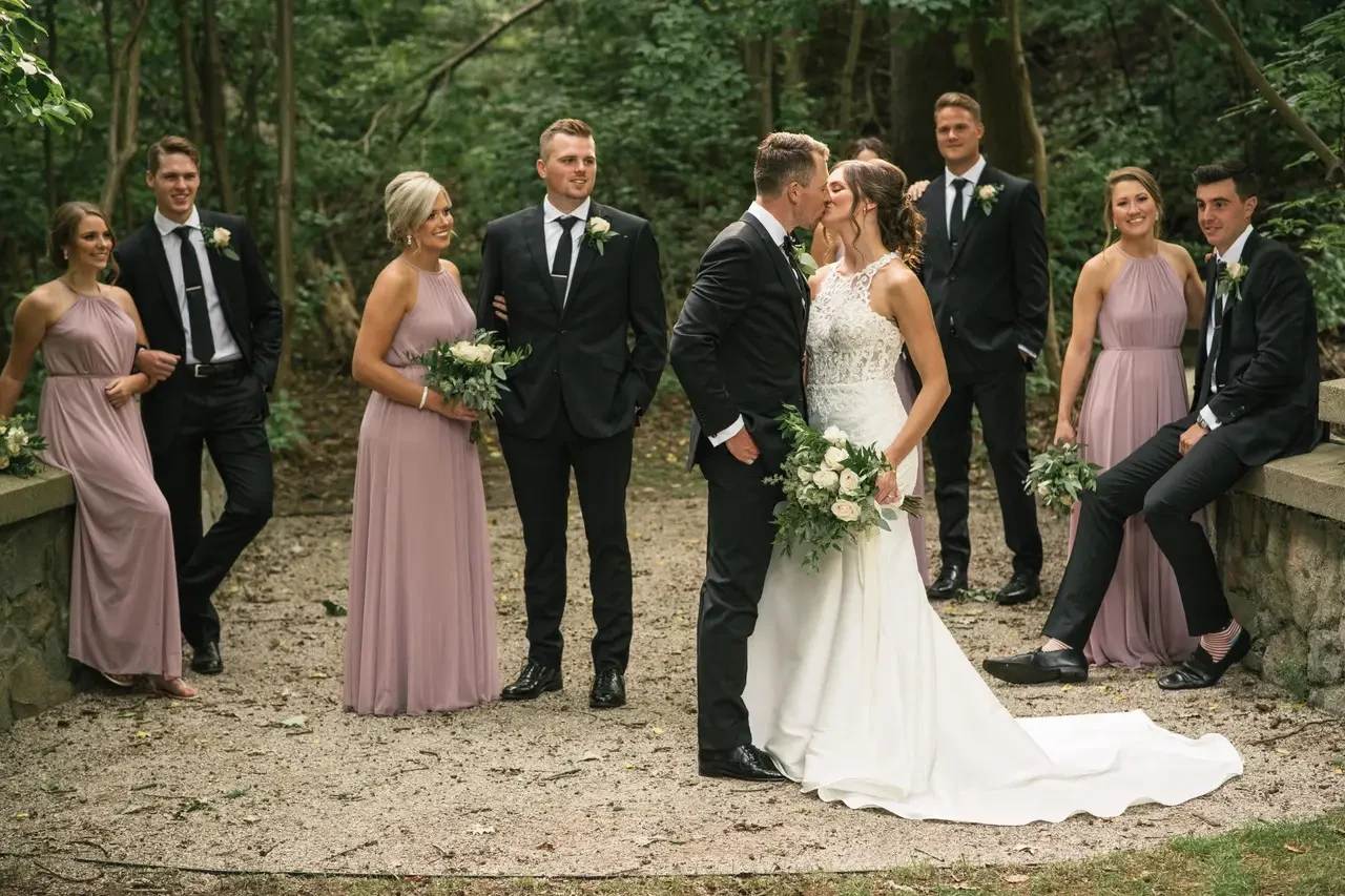 Wedding party posing outdoors
