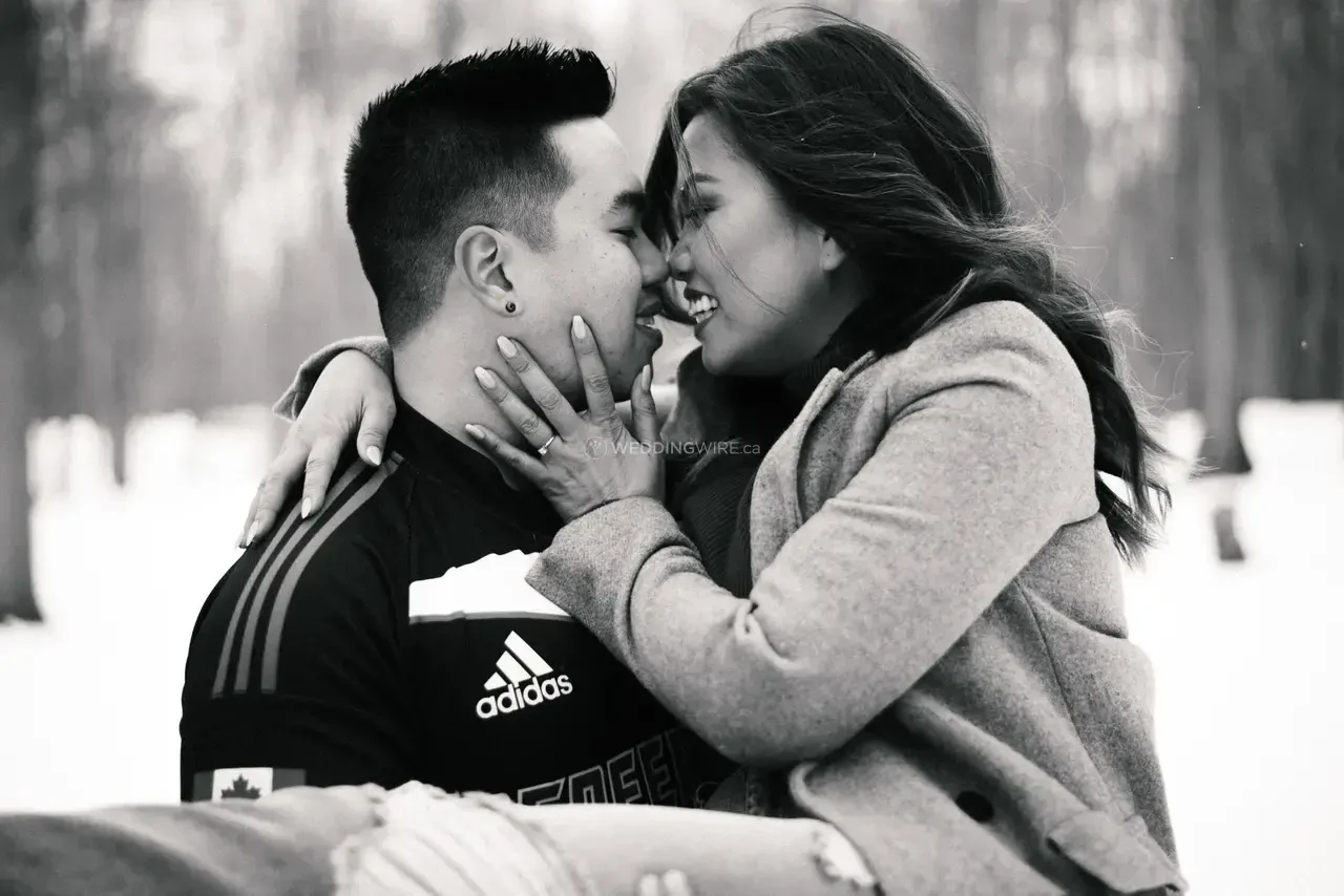 Black and white portrait of a couple embracing in winter